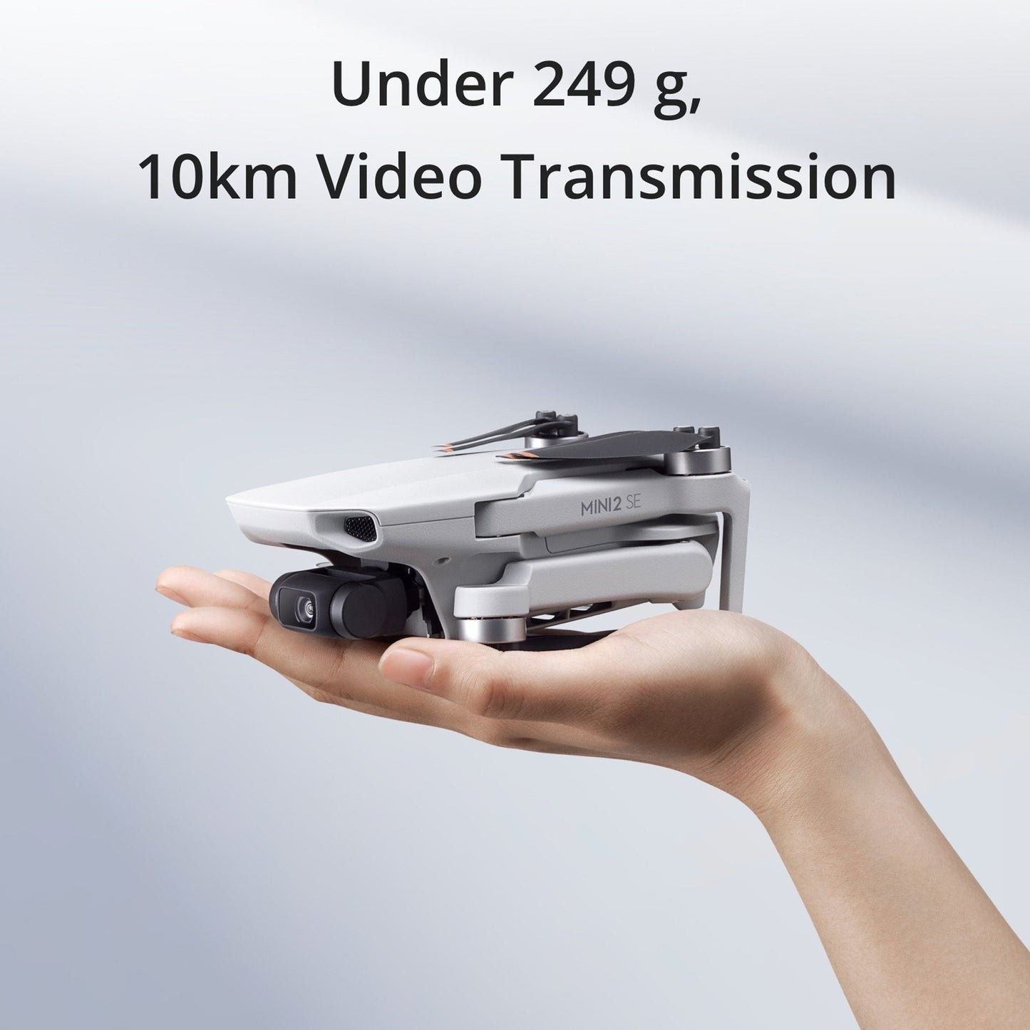 DJI Mini 2 SE Bundle with 64GB MicroSDXC Memory Card and 30-Inch Double-Sided Drone Landing Pad